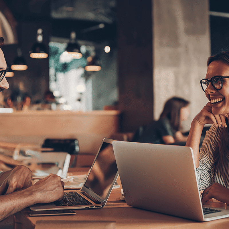 Two realtors discussing marketing automation.
