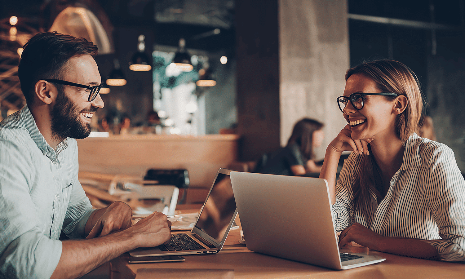 Two realtors discussing marketing automation.