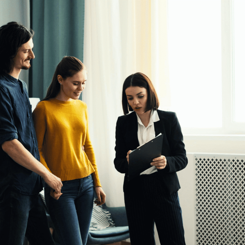 Couple consulting with a real estate agent.